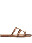 Sandalia baja tipo slide Rockstud de Valentino Garavani en napa laminada