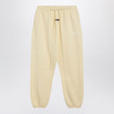 Fear of God Essentials Yellow jogging pants with logo